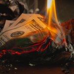Burning money, Image Courtesy of Unsplash.com